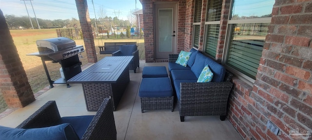 view of patio / terrace with an outdoor hangout area and a grill