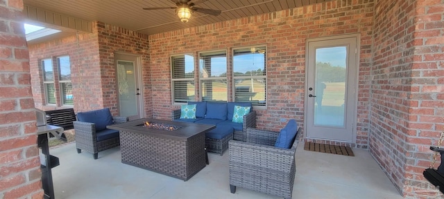 view of patio / terrace featuring an outdoor living space with a fire pit and ceiling fan