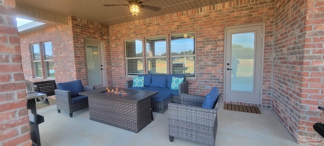 view of patio with an outdoor living space and ceiling fan