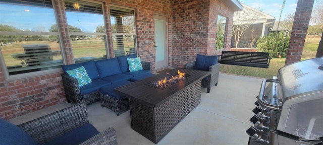 view of patio featuring an outdoor living space with a fire pit and grilling area