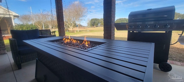 view of patio / terrace featuring an outdoor fire pit and area for grilling