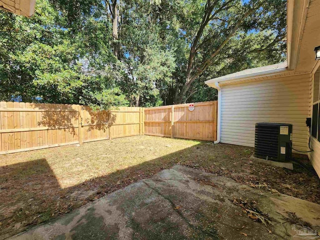 view of yard with a patio area and central AC unit