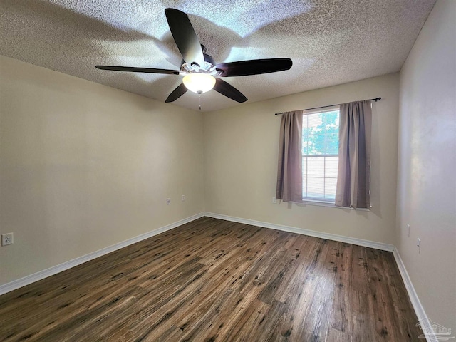 spare room featuring ceiling fan, a textured ceiling, and dark hardwood / wood-style flooring