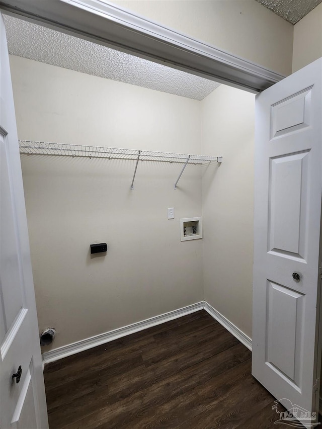 laundry area featuring hookup for a washing machine, dark hardwood / wood-style floors, and a textured ceiling