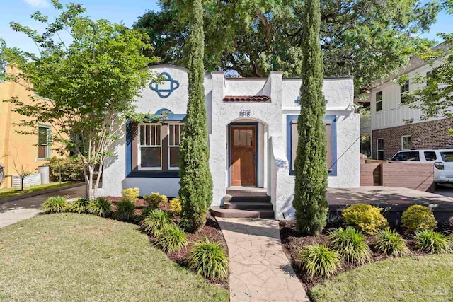 mediterranean / spanish-style house with stucco siding