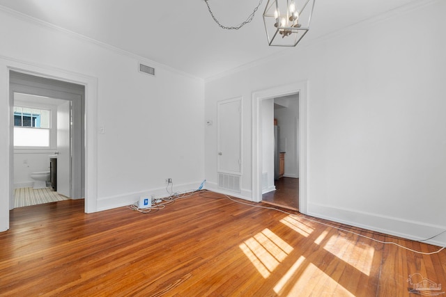 unfurnished bedroom featuring visible vents and crown molding