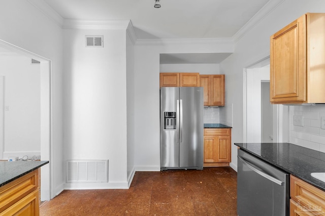 kitchen with dark floors, visible vents, appliances with stainless steel finishes, and ornamental molding