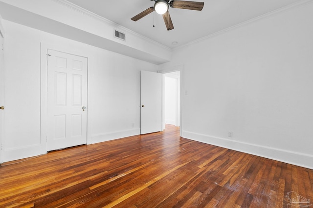 unfurnished bedroom featuring baseboards, visible vents, ceiling fan, hardwood / wood-style flooring, and ornamental molding