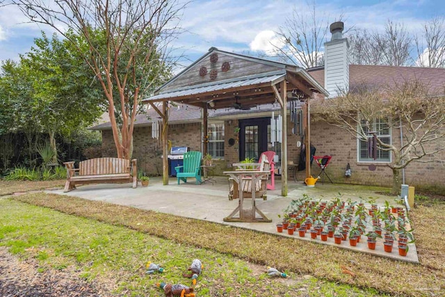 back of house with a patio