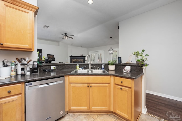 kitchen featuring dark stone countertops, stainless steel dishwasher, ceiling fan, sink, and kitchen peninsula