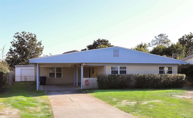 ranch-style house with a carport, a garage, and a front lawn