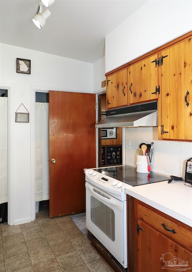 kitchen featuring white range with electric stovetop