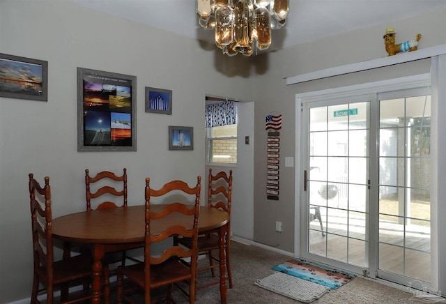 dining space with a chandelier