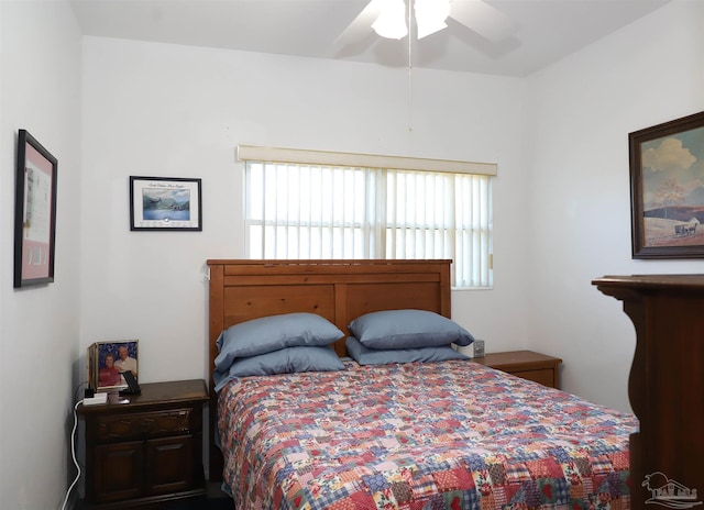 bedroom with multiple windows and ceiling fan