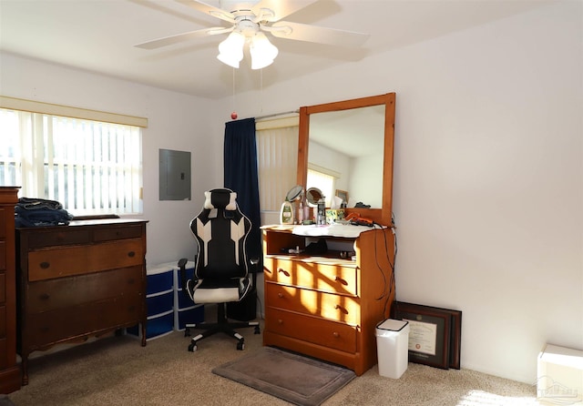 carpeted office space with electric panel and ceiling fan