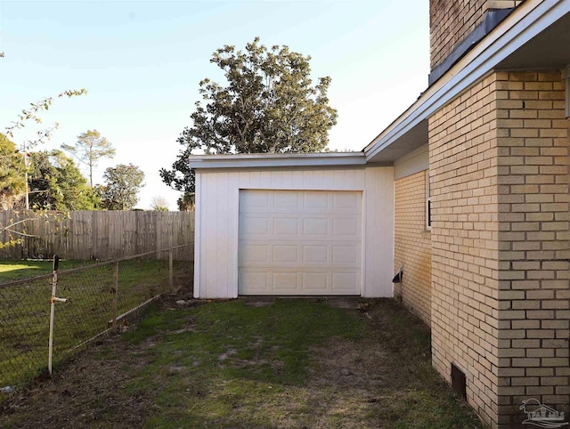 garage with a yard