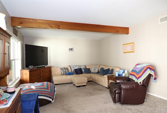 living room with light carpet and beam ceiling