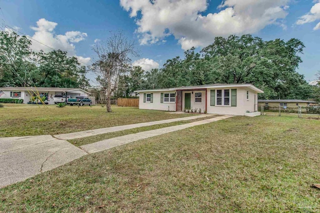 single story home with a front lawn