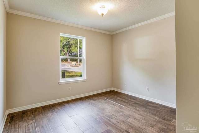 spare room with wood-type flooring, a textured ceiling, and ornamental molding