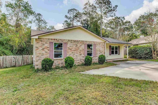 single story home with a patio and a front yard