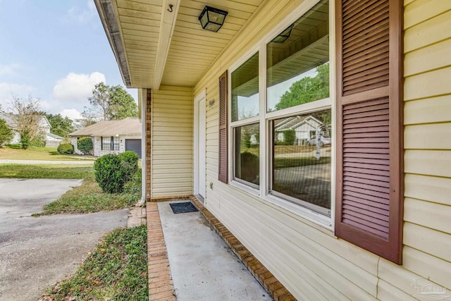 view of side of property with covered porch