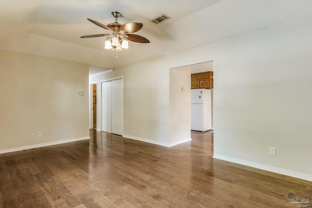 unfurnished room featuring a textured ceiling, hardwood / wood-style flooring, and ceiling fan