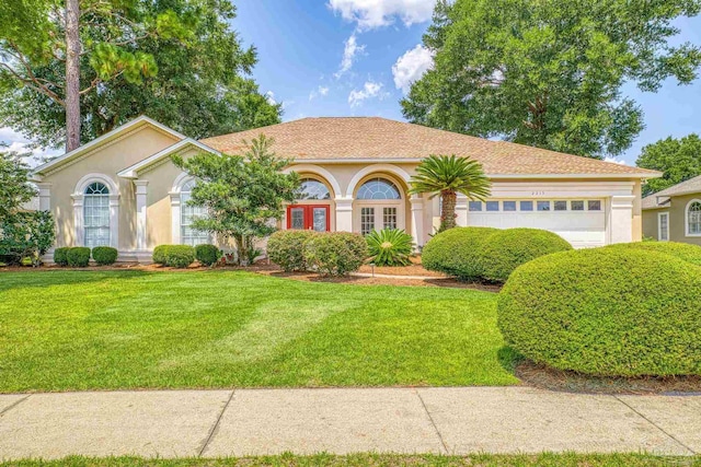 view of front facade featuring a garage and a front yard