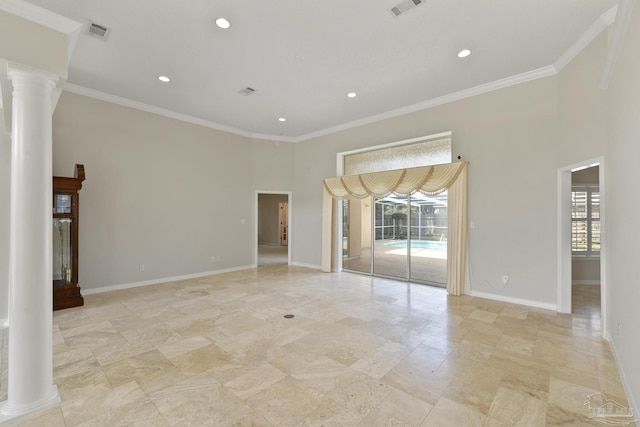 unfurnished room with crown molding, a healthy amount of sunlight, and ornate columns