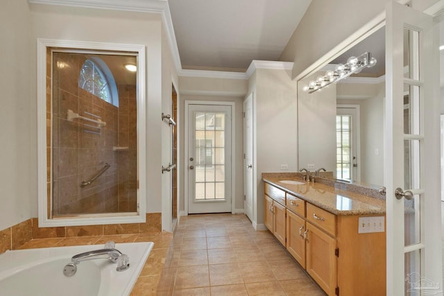 bathroom with vanity, tile patterned floors, crown molding, and plus walk in shower