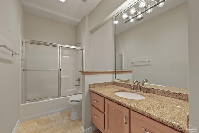 full bathroom featuring vanity, enclosed tub / shower combo, and toilet