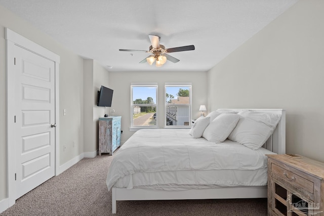 bedroom with carpet flooring, ceiling fan, and baseboards