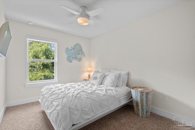 bedroom featuring carpet floors, a ceiling fan, and baseboards