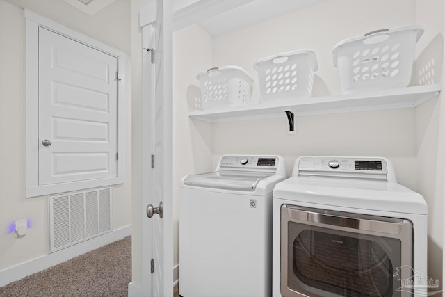 washroom featuring laundry area, separate washer and dryer, carpet flooring, and visible vents