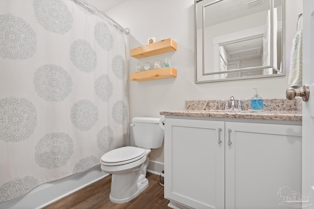 bathroom featuring vanity, curtained shower, wood finished floors, and toilet