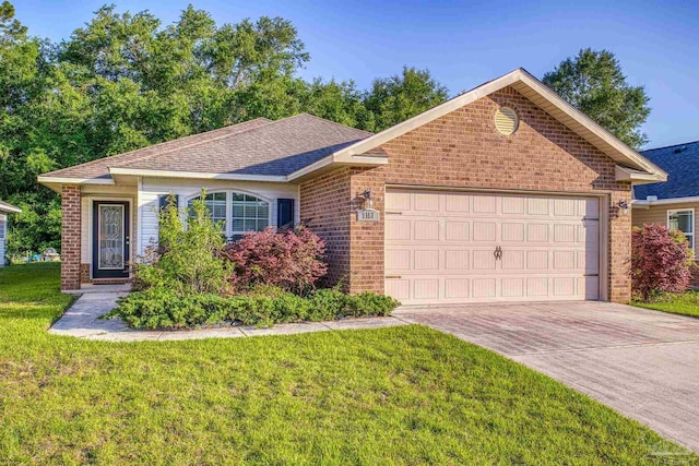 5183 Teresa Dr, Milton, FL 32583 - single story home with brick siding, an attached garage, concrete driveway, and a front lawn