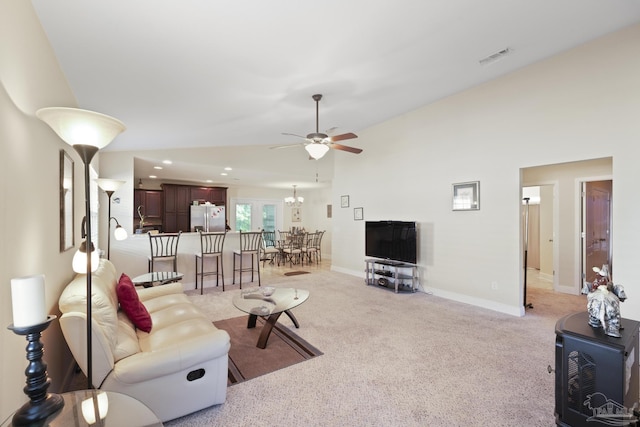 5183 Teresa Dr, Milton, FL 32583 - living area with vaulted ceiling, ceiling fan, light carpet, and baseboards