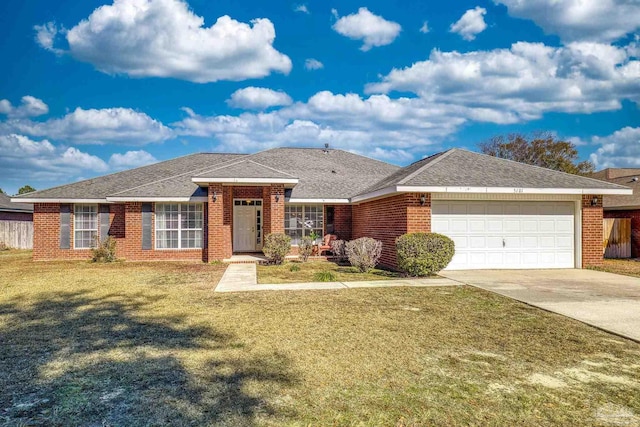 single story home featuring a garage and a front lawn