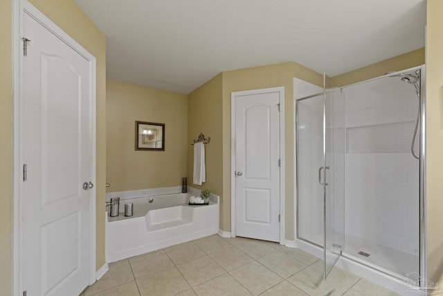 bathroom with plus walk in shower and tile patterned flooring