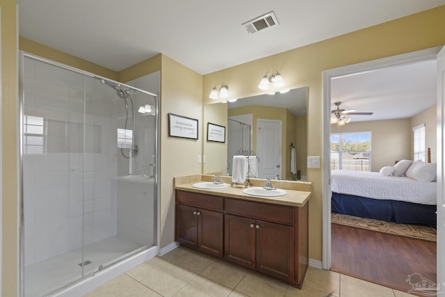 bathroom featuring vanity, ceiling fan, tile patterned floors, and an enclosed shower