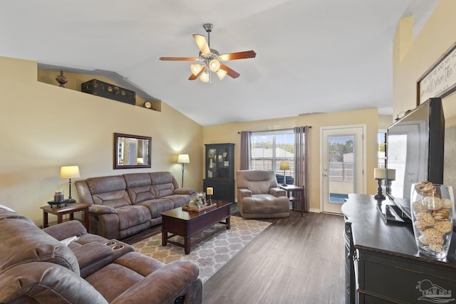 living room featuring ceiling fan, hardwood / wood-style floors, and lofted ceiling