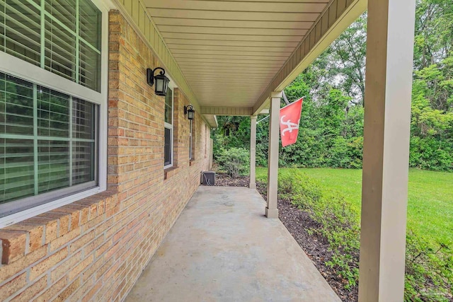 106 W Meadow Dr, Atmore, AL 36502 - covered porch featuring a yard