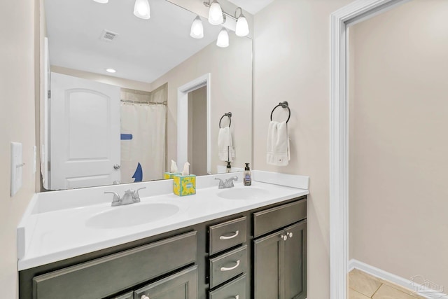 106 W Meadow Dr, Atmore, AL 36502 - bathroom featuring double vanity and tile patterned floors