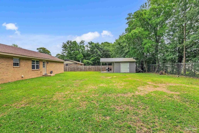 106 W Meadow Dr, Atmore, AL 36502 - view of yard featuring a garage