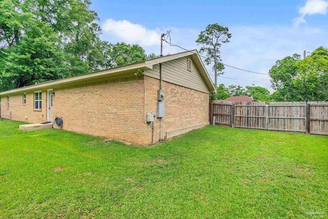 106 W Meadow Dr, Atmore, AL 36502 - view of home's exterior with brick siding