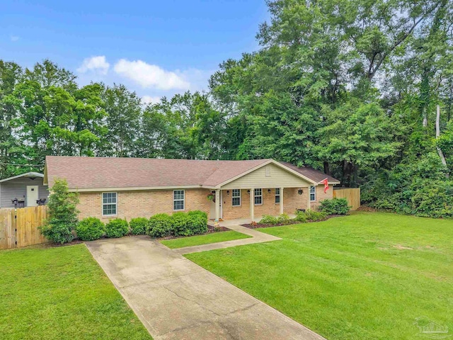 106 W Meadow Dr, Atmore, AL 36502 - ranch-style house featuring concrete driveway, brick siding, and roof with shingles
