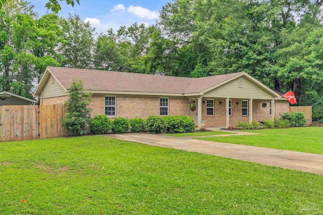 106 W Meadow Dr, Atmore, AL 36502 - ranch-style home featuring brick siding, a shingled roof, and a porch