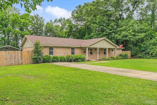 106 W Meadow Dr, Atmore, AL 36502 - single story home featuring brick siding, a porch, and a shingled roof
