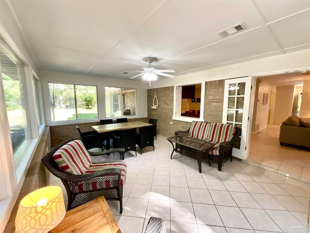 sunroom with ceiling fan