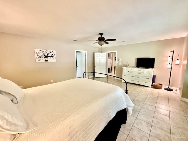 tiled bedroom with ceiling fan