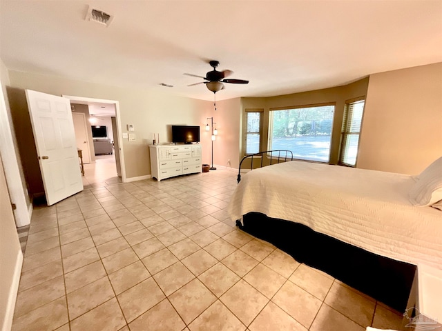 unfurnished bedroom featuring light tile patterned floors and ceiling fan